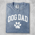 Comfort Colors grey t-shirt with "DOG DAD" and a paw print.