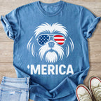 Blue t-shirt with white graphic of dog wearing American flag sunglasses and text 'MERICA