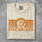 Cream t-shirt with "STAY GOLDEN" text and a golden retriever wearing sunglasses.
