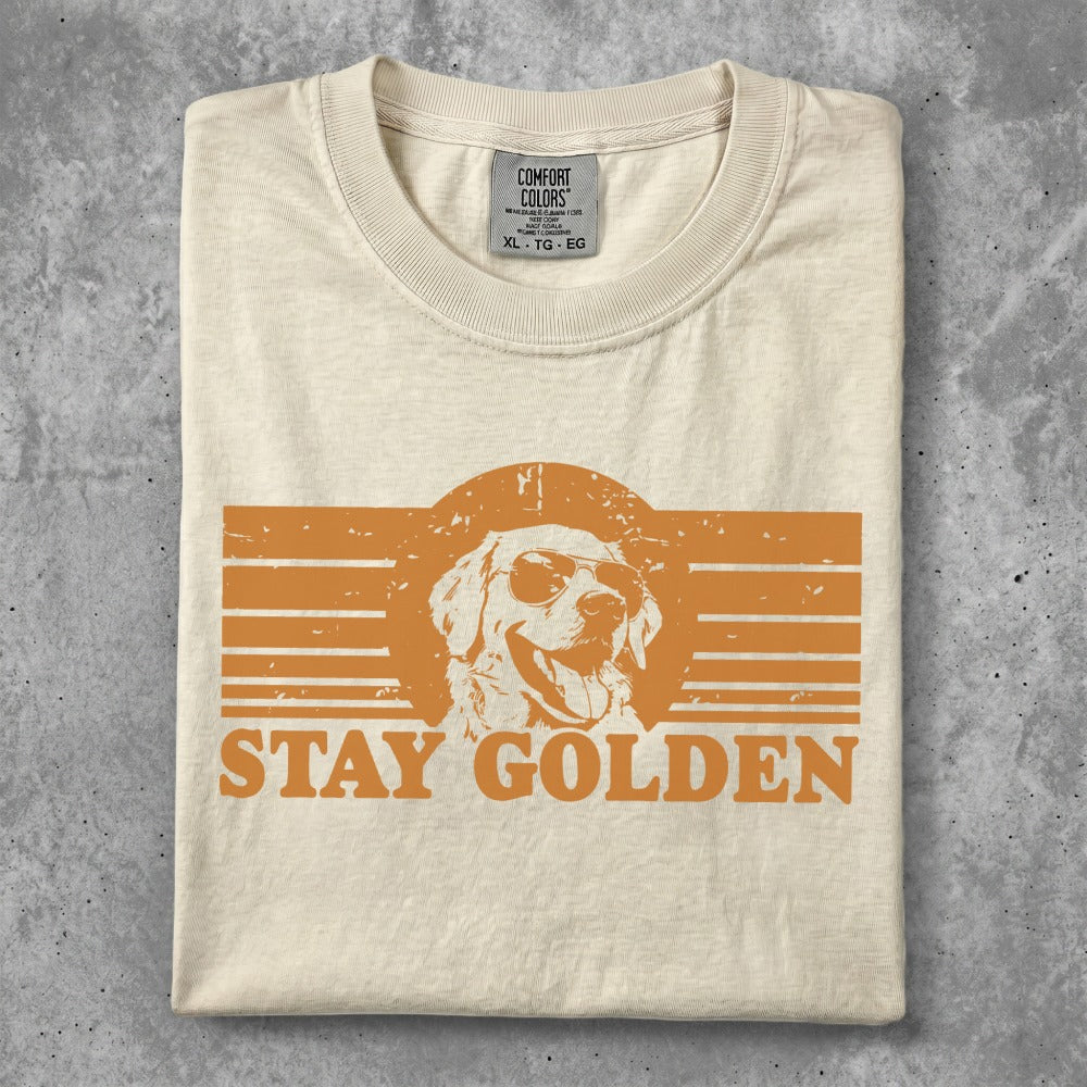 Cream t-shirt with "STAY GOLDEN" text and a golden retriever wearing sunglasses.