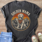 Graphic tee with retro design of a golden retriever wearing a bandana, sunset and mountains.