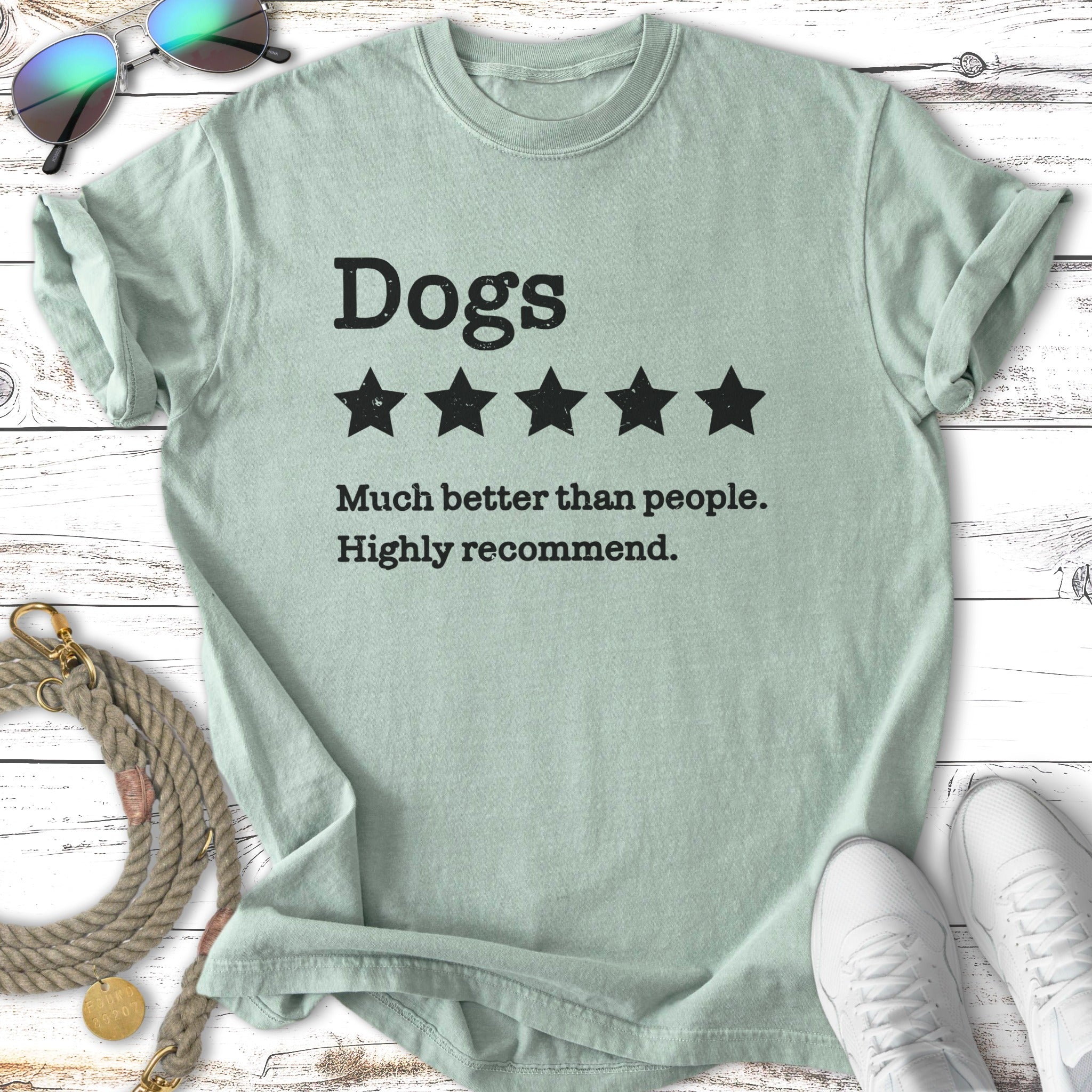 Light green t-shirt with "Dogs ★★★★ Much better than people. Highly recommend." text.