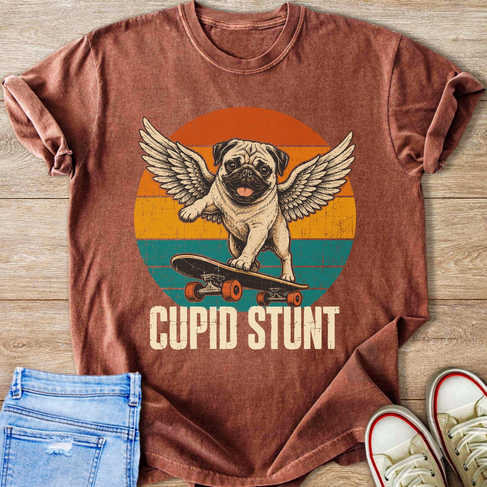 Pug with wings skateboarding with text "CUPID STUNT"