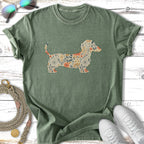 Green t-shirt with a floral dachshund silhouette.