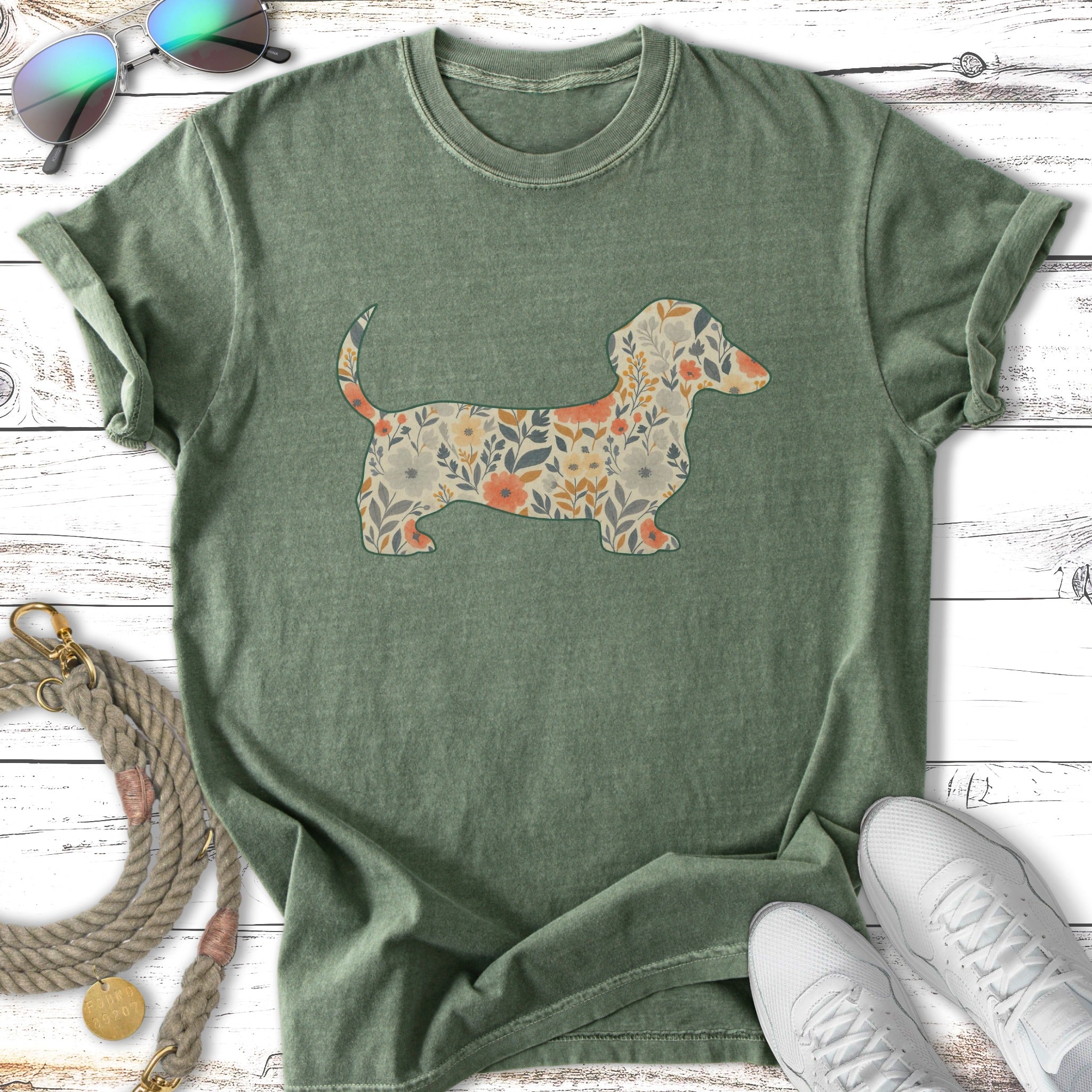 Green t-shirt with a floral dachshund silhouette.