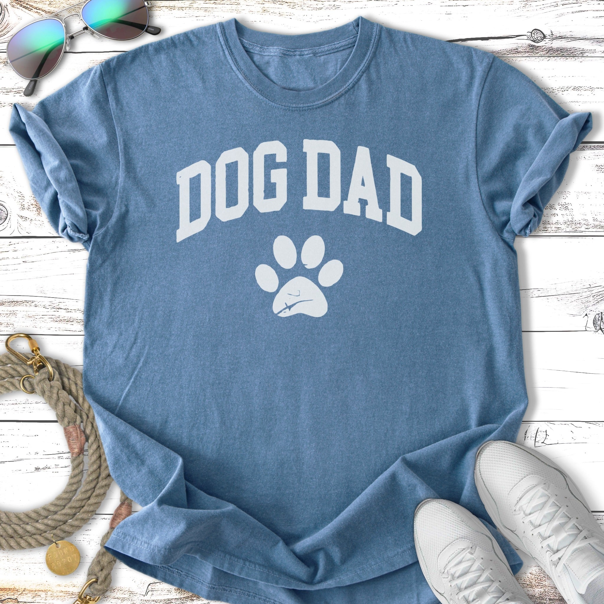 Blue t-shirt with "DOG DAD" and paw print graphic.
