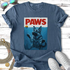 German Shepherd dog swimming underwater with "PAWS" text above.