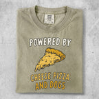 Green t-shirt with text "POWERED BY CHEESE PIZZA AND DOGS" and a slice of pizza.