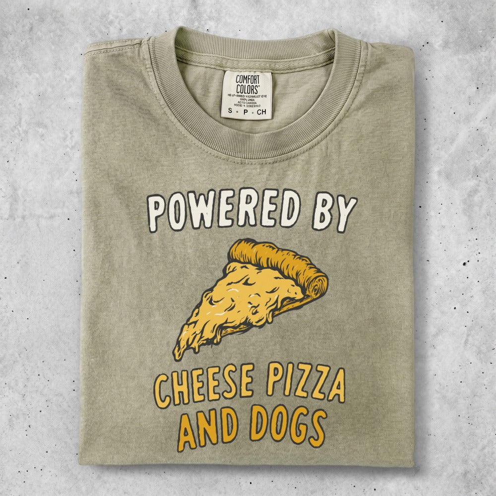 Green t-shirt with text "POWERED BY CHEESE PIZZA AND DOGS" and a slice of pizza.