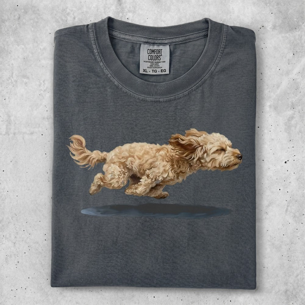 T-shirt with a watercolor painting of a small, light-colored dog running.