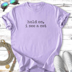 Light purple t-shirt with "Hold on, I see a cat" text.