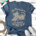 Blue t-shirt with a tabby cat stretching and the text "My Pussy Loves. A Good Stretch."
