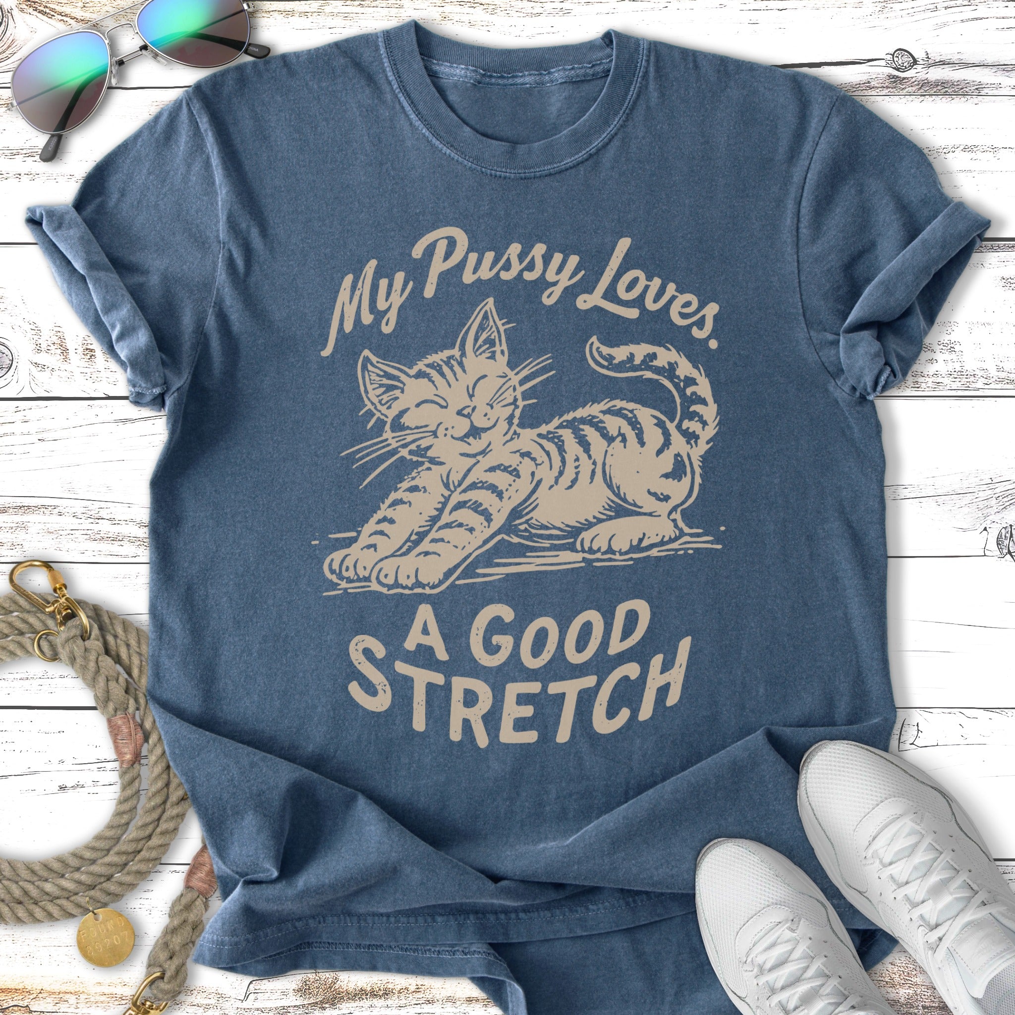 Blue t-shirt with a tabby cat stretching and the text "My Pussy Loves. A Good Stretch."
