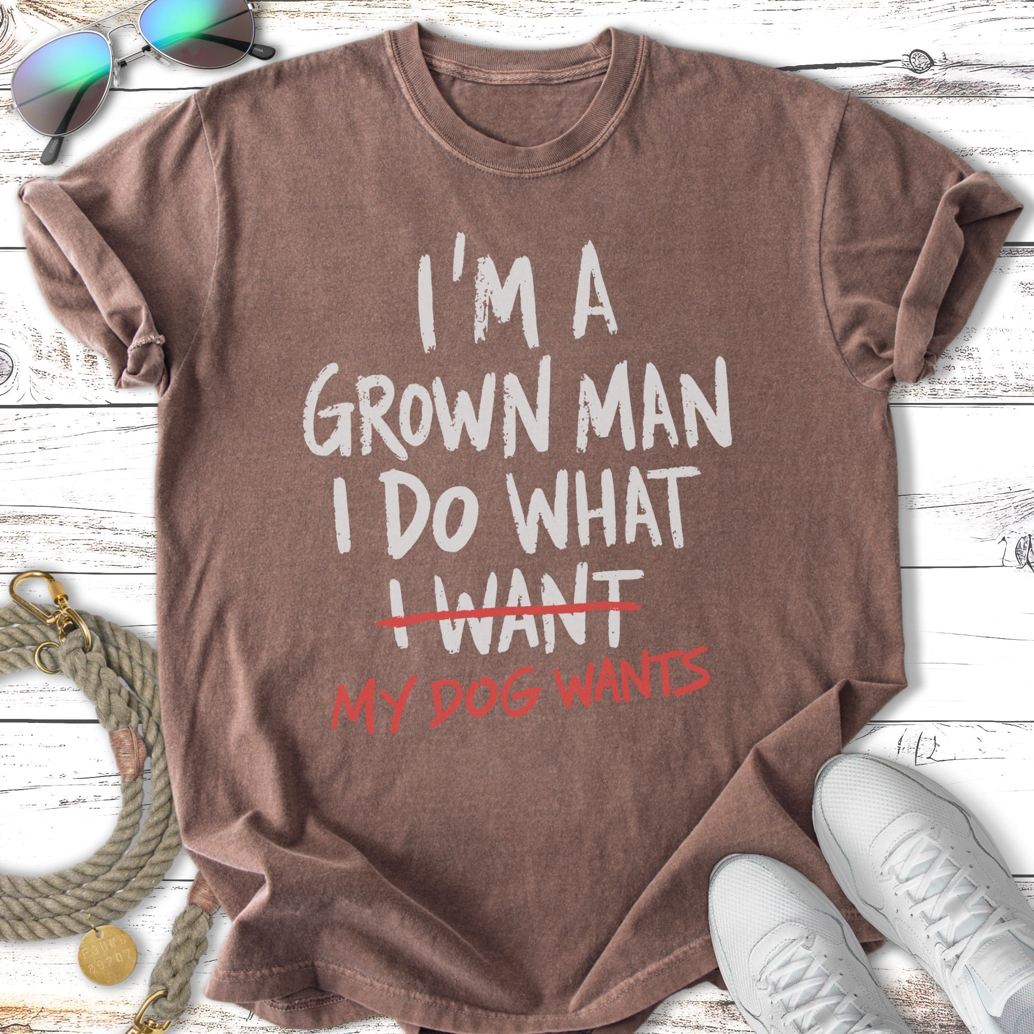 Brown t-shirt with text "I'm a grown man, I do what my dog wants."