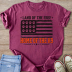 T-shirt with distressed flag design, paw prints, and "Land of the Free Home of the K9" text.
