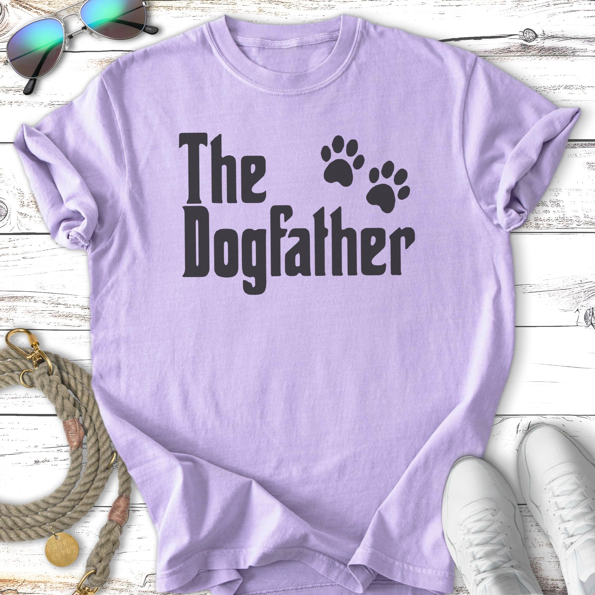 Lavender t-shirt with "The Dogfather" text and paw prints.