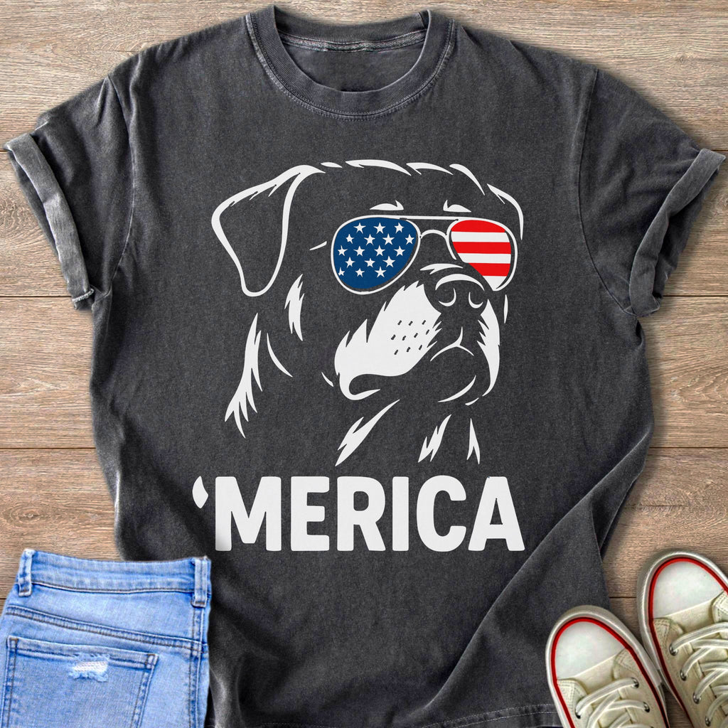 Dark t-shirt with white graphic of a dog wearing American flag sunglasses and the word 'MERICA.