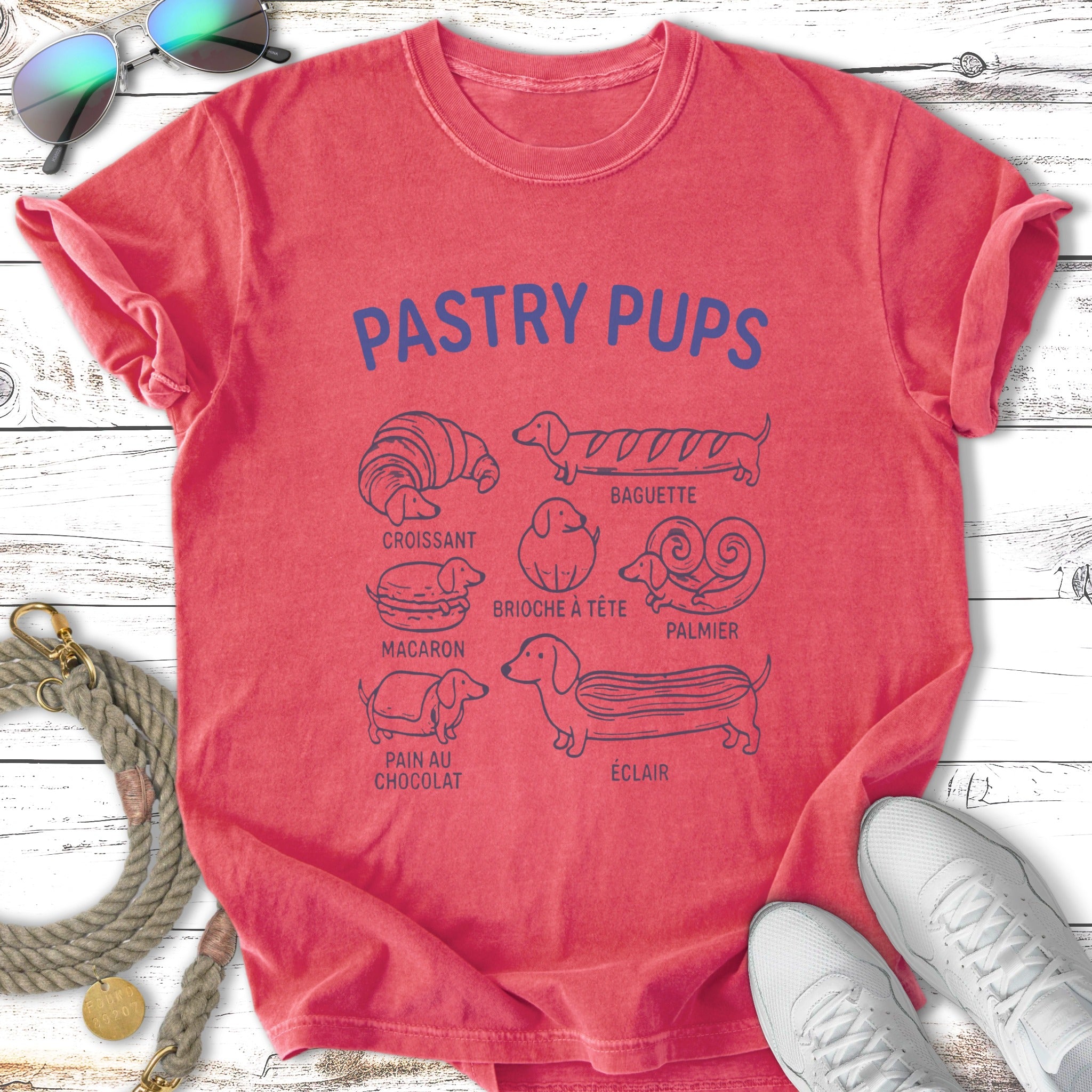 Pastry Pups t-shirt with drawings of various French pastries like croissant and baguette.