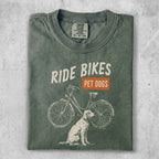T-shirt with "Ride Bikes Pet Dogs" text and illustrated dog and bicycle.