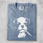 Blue t-shirt with a white graphic of a dog smoking a cigarette.