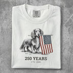 Dachshund holding American flag with "250 Years 1776-2026" text.