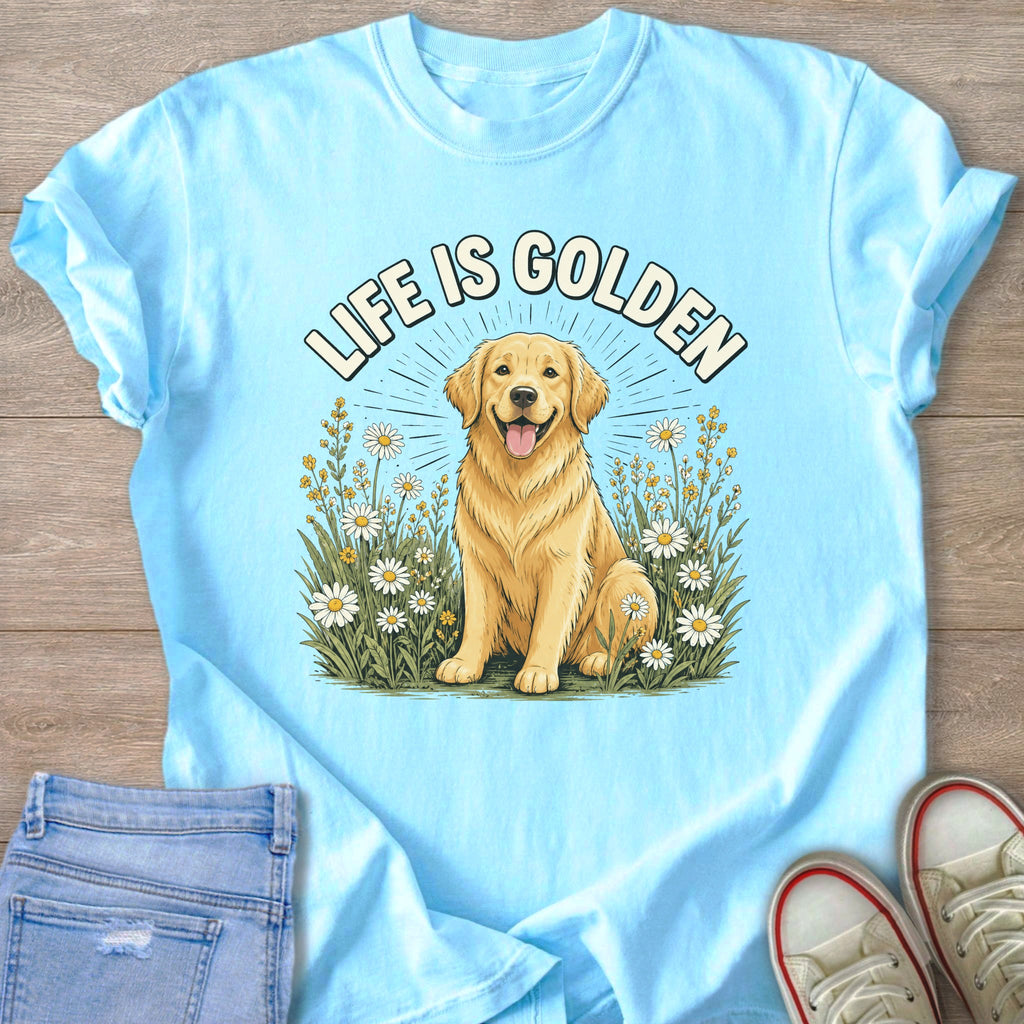 Light blue t-shirt graphic with text "LIFE IS GOLDEN" and a golden retriever in a field of daisies.