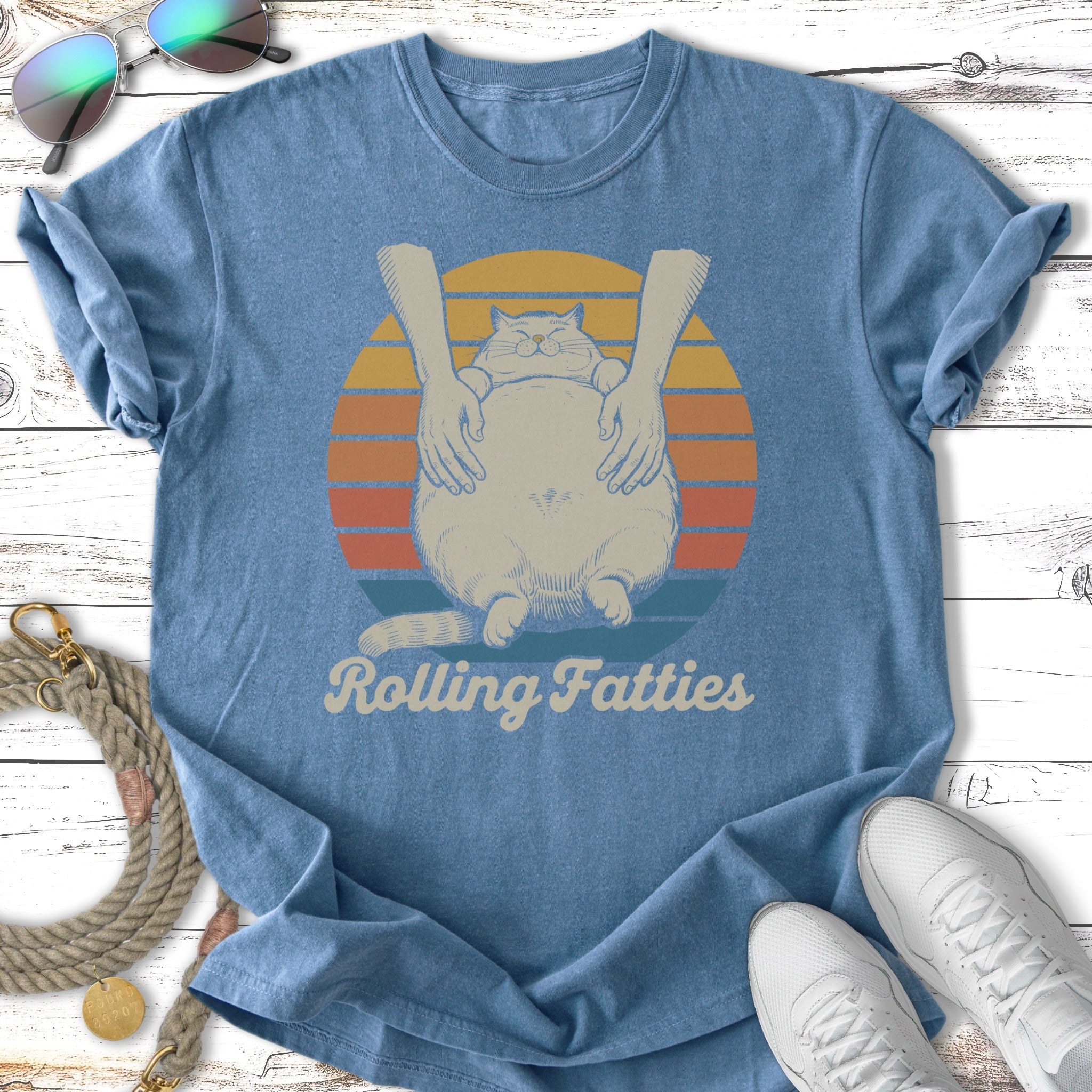 T-shirt with a cartoon cat being hugged, with text "Rolling Fatties".