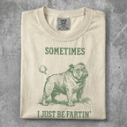 Cream t-shirt with a bulldog graphic and text "SOMETIMES I JUST BE FARTIN'".