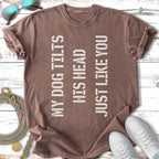 Brown t-shirt with text "MY DOG TILTS HIS HEAD JUST LIKE YOU" in white.