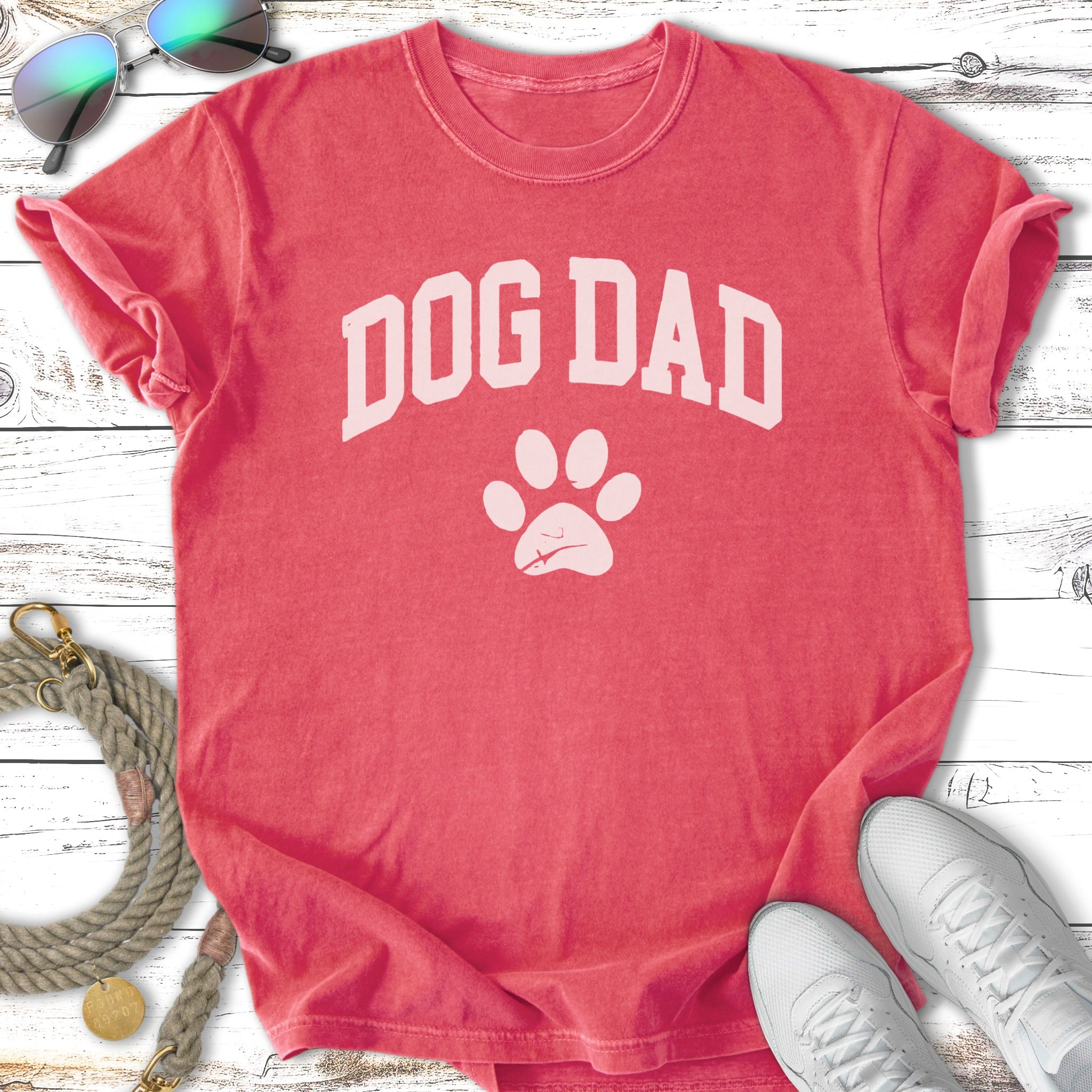 Coral t-shirt with "DOG DAD" and paw print graphic.
