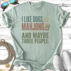 T-shirt with "I Like Dogs, Mahjong, and Maybe Three People" text.