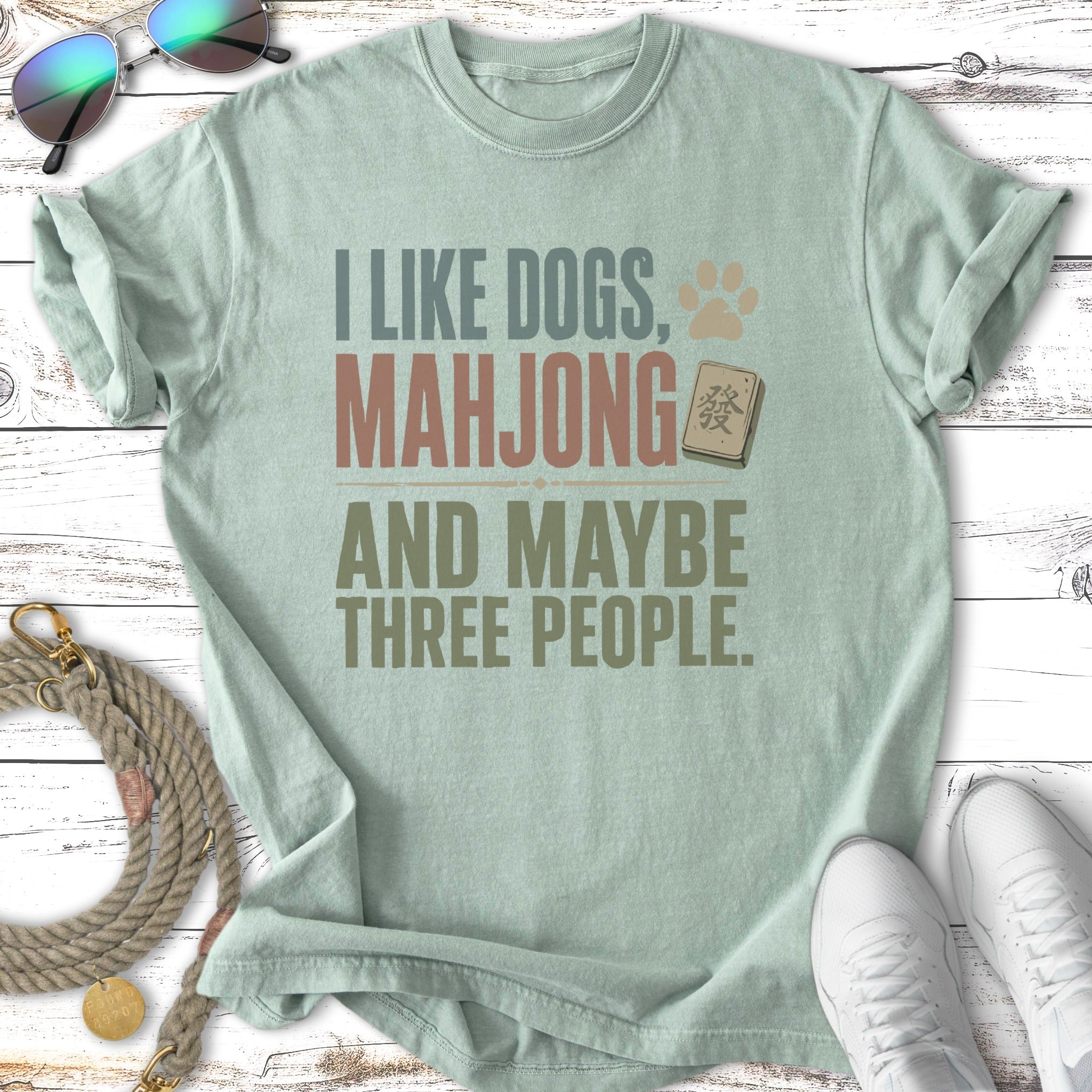 T-shirt with "I Like Dogs, Mahjong, and Maybe Three People" text.