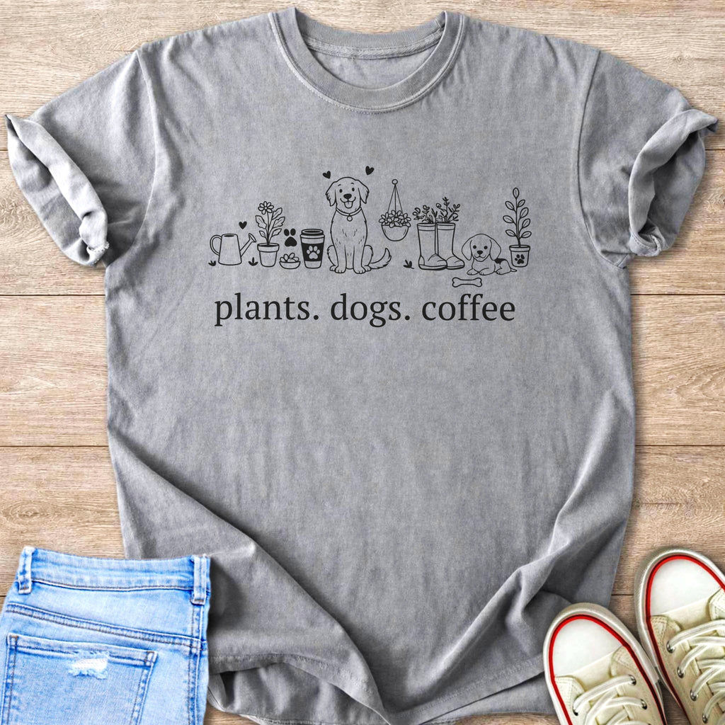 Gray t-shirt with line art of plants, dogs, and coffee, and text "plants. dogs. coffee".