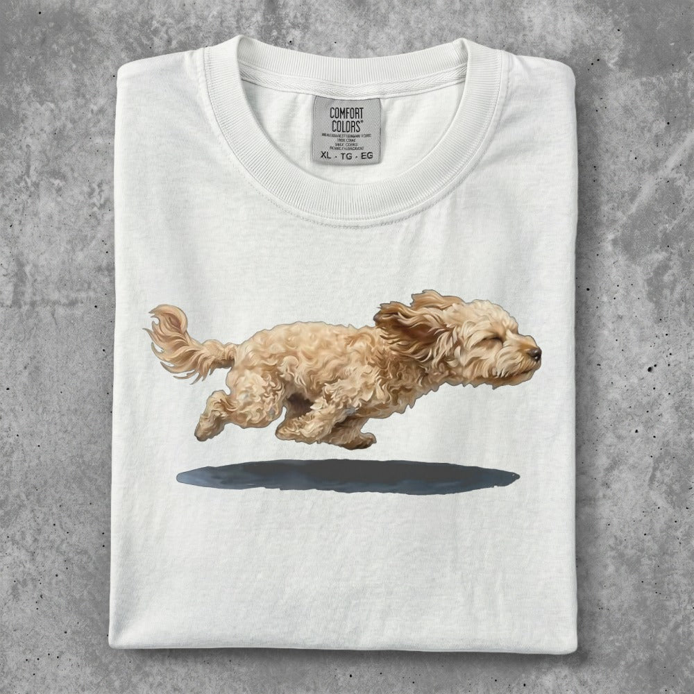 White t-shirt with a cartoon drawing of a light brown dog running.