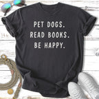 Dark grey t-shirt with "Pet dogs. Read books. Be happy." slogan.