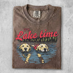 Two golden retrievers swim in water with "Lake time" text.