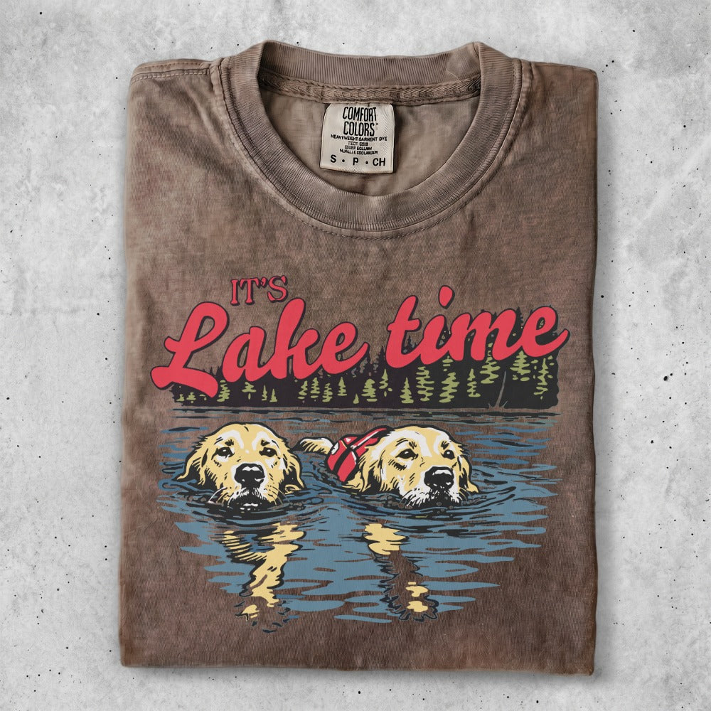 Two golden retrievers swim in water with "Lake time" text.