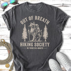 T-shirt with a cat hiking, "OUT OF BREATH HIKING SOCIETY" text.