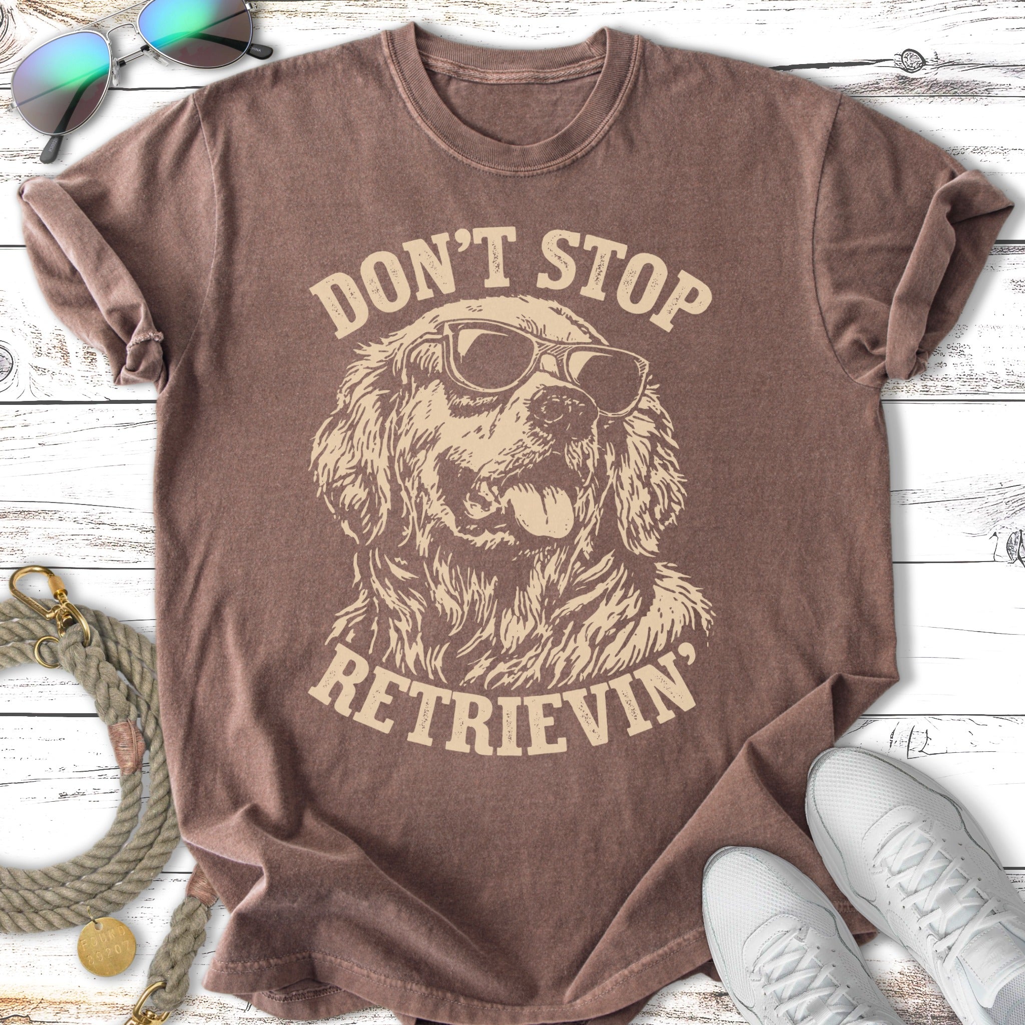 Brown t-shirt with distressed graphic of a Golden Retriever wearing sunglasses.