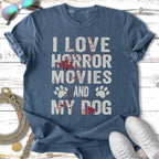 Blue t-shirt with text "I LOVE HORROR MOVIES AND MY DOG" and paw prints.