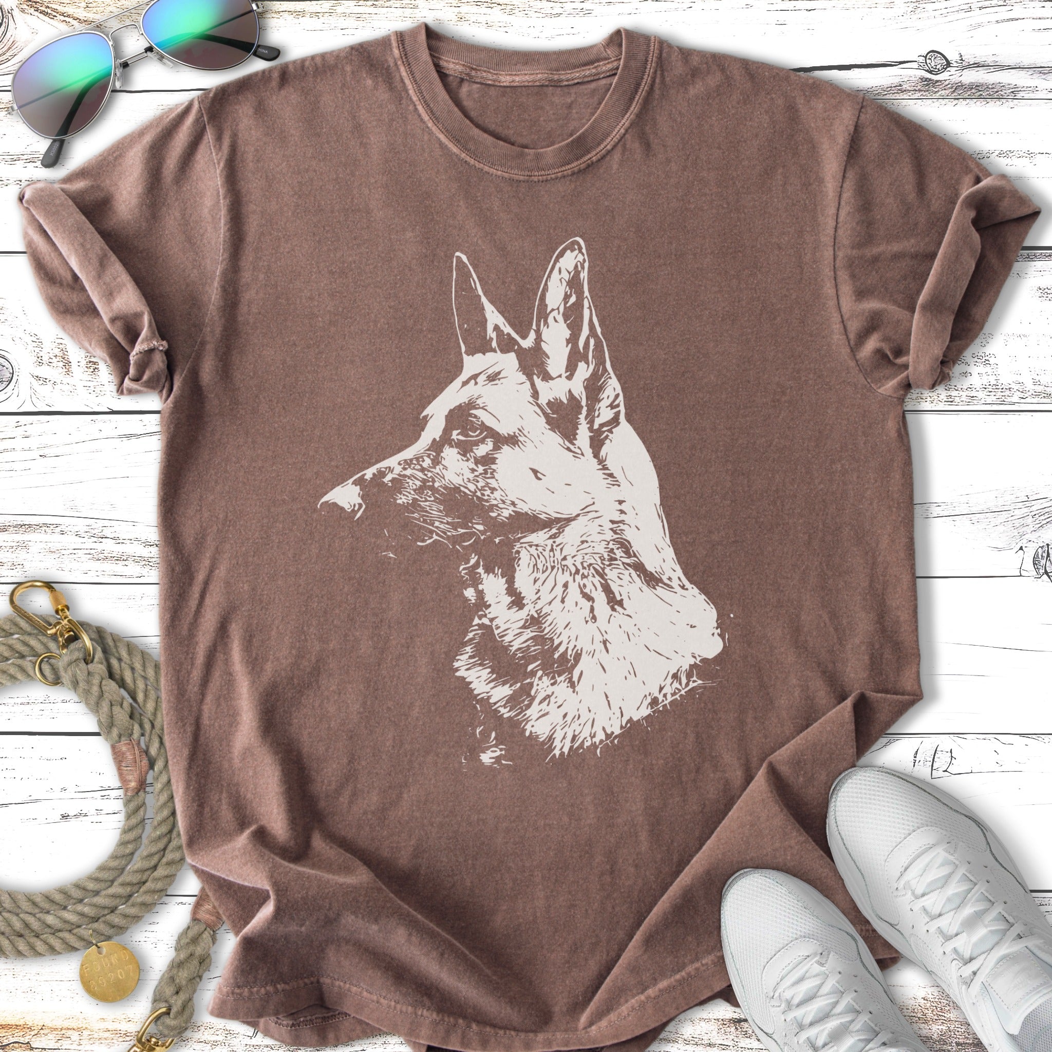 T-shirt with a German Shepherd head sketch on a brown background.