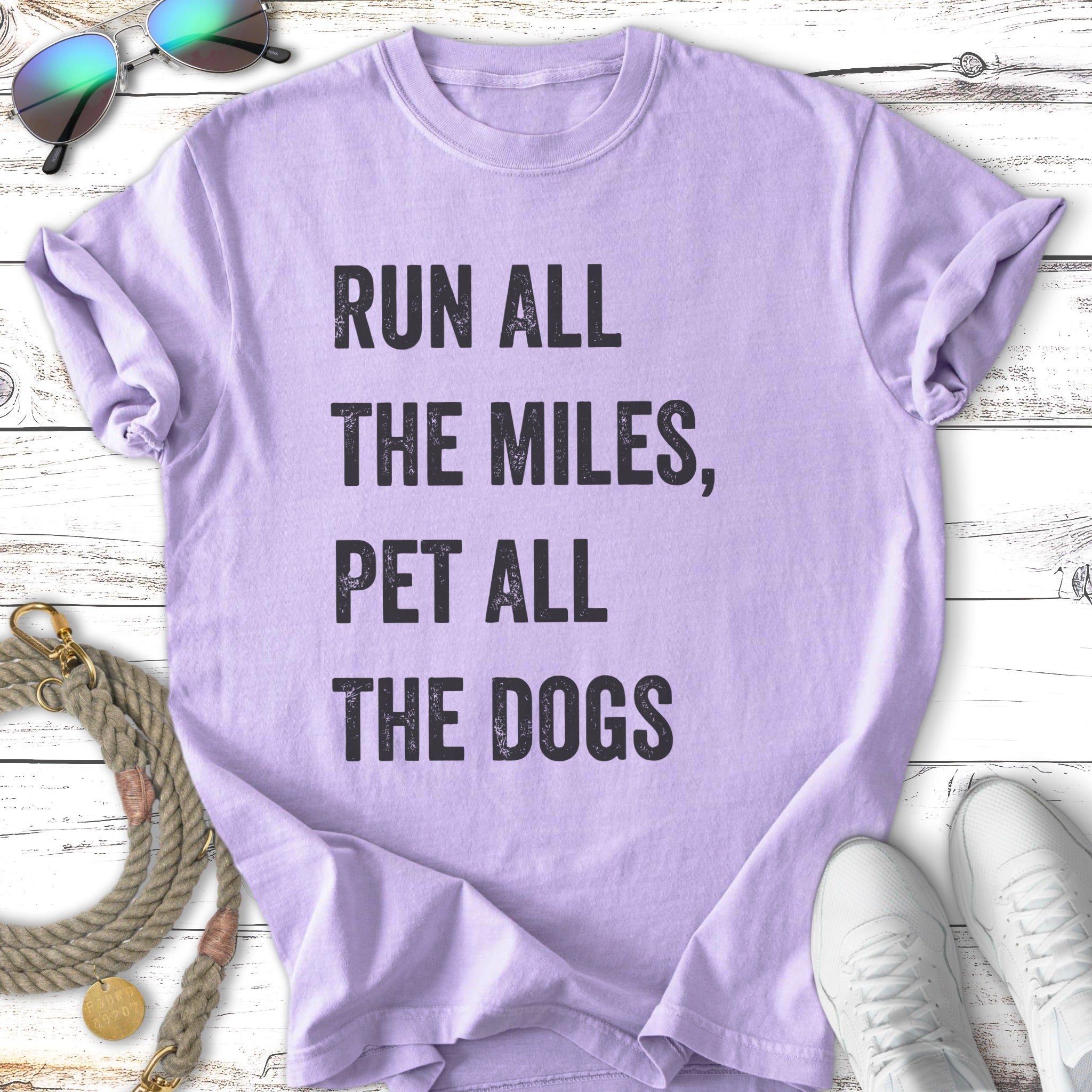 Purple t-shirt with "Run All The Miles, Pet All The Dogs" text.