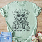 Light green t-shirt with a dog wearing sunglasses holding a drink and fries.