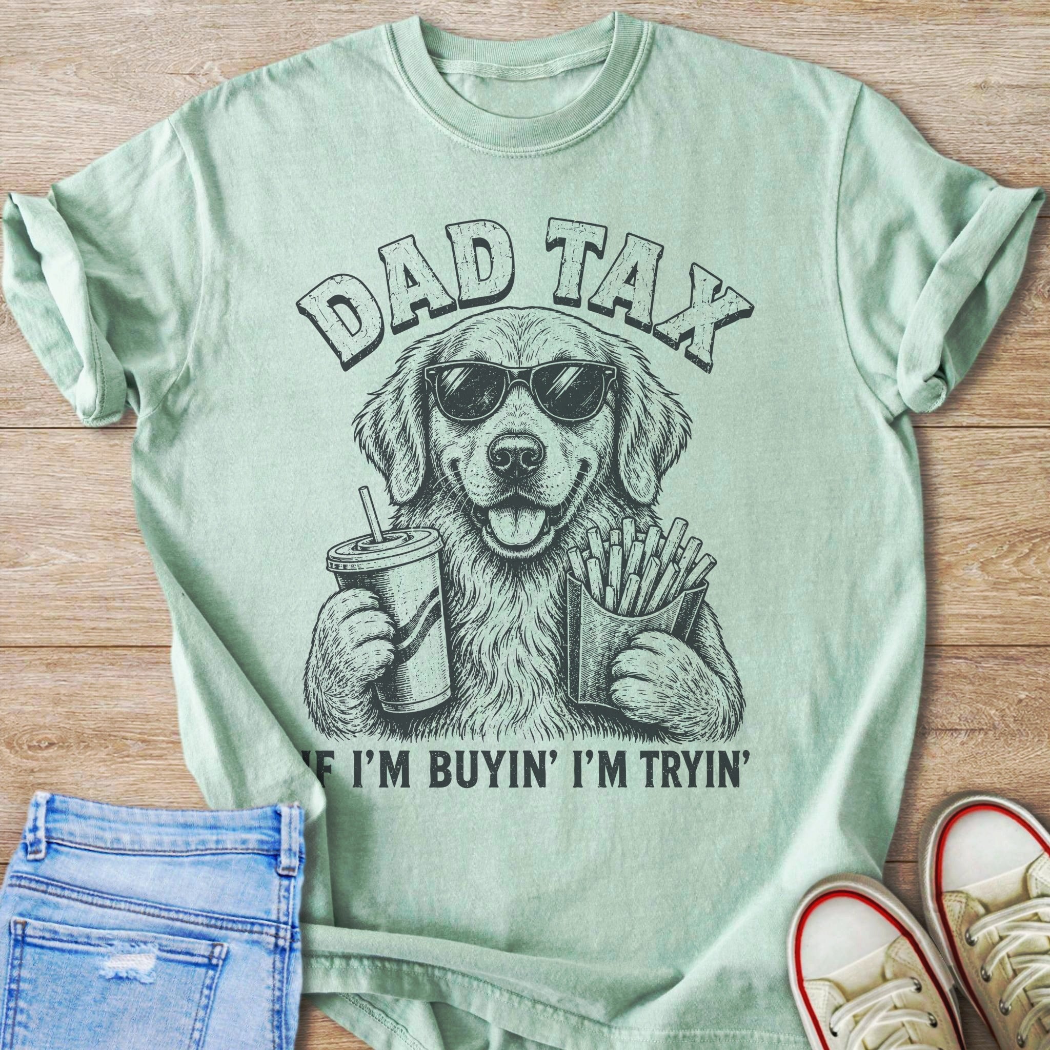 Light green t-shirt with a dog wearing sunglasses holding a drink and fries.