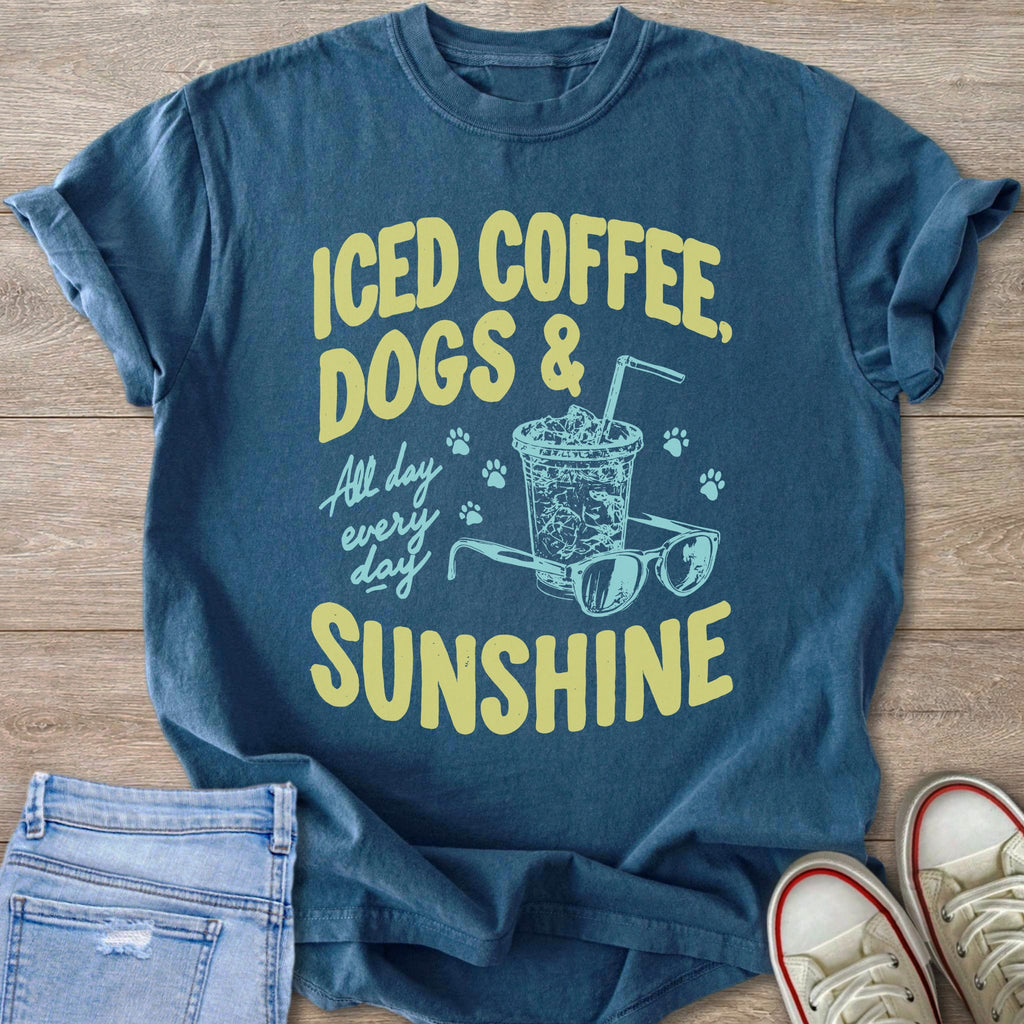 Blue t-shirt with text "Iced Coffee, Dogs & Sunshine" and graphic.