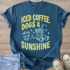 Blue t-shirt with text "Iced Coffee, Dogs & Sunshine" and graphic.