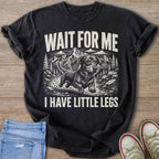 Black t-shirt with a black and white print of a dachshund running with mountains and "WAIT FOR ME I HAVE LITTLE LEGS"