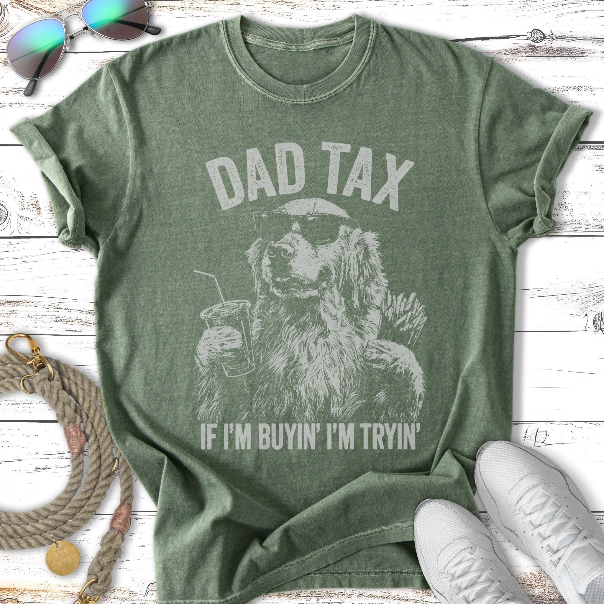 Green t-shirt with "Dad Tax" graphic and dog holding drink and fries.