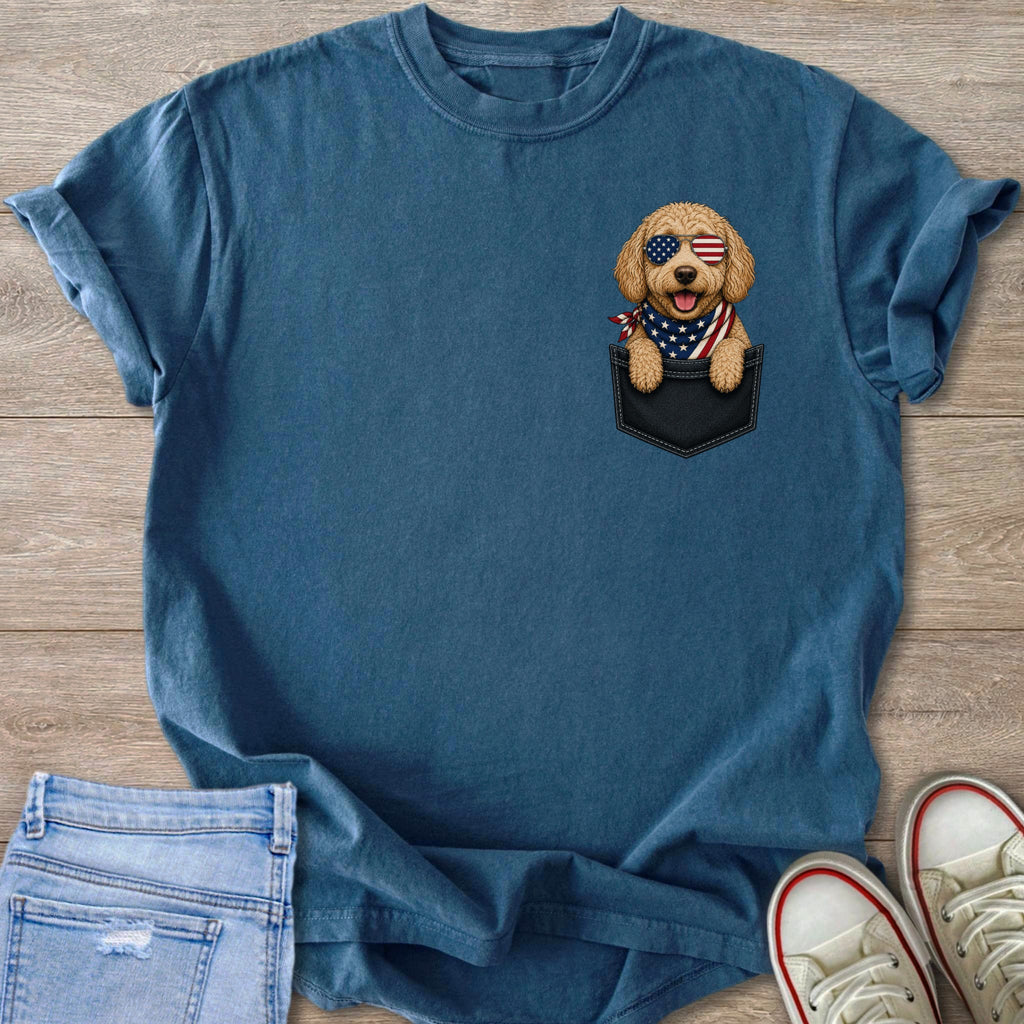Blue t-shirt with a dog wearing American flag sunglasses and bandana in a pocket.