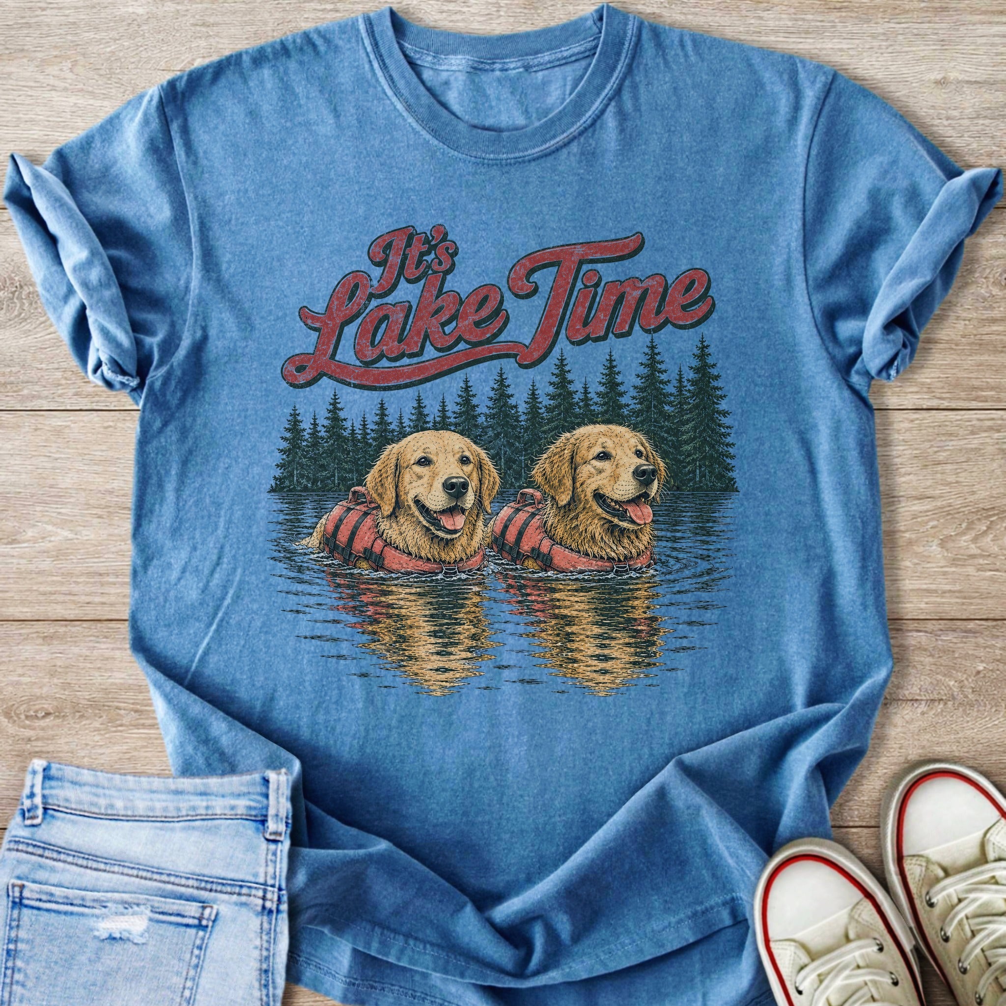 Blue t-shirt graphic with "It's Lake Time" and two golden retrievers in life vests.